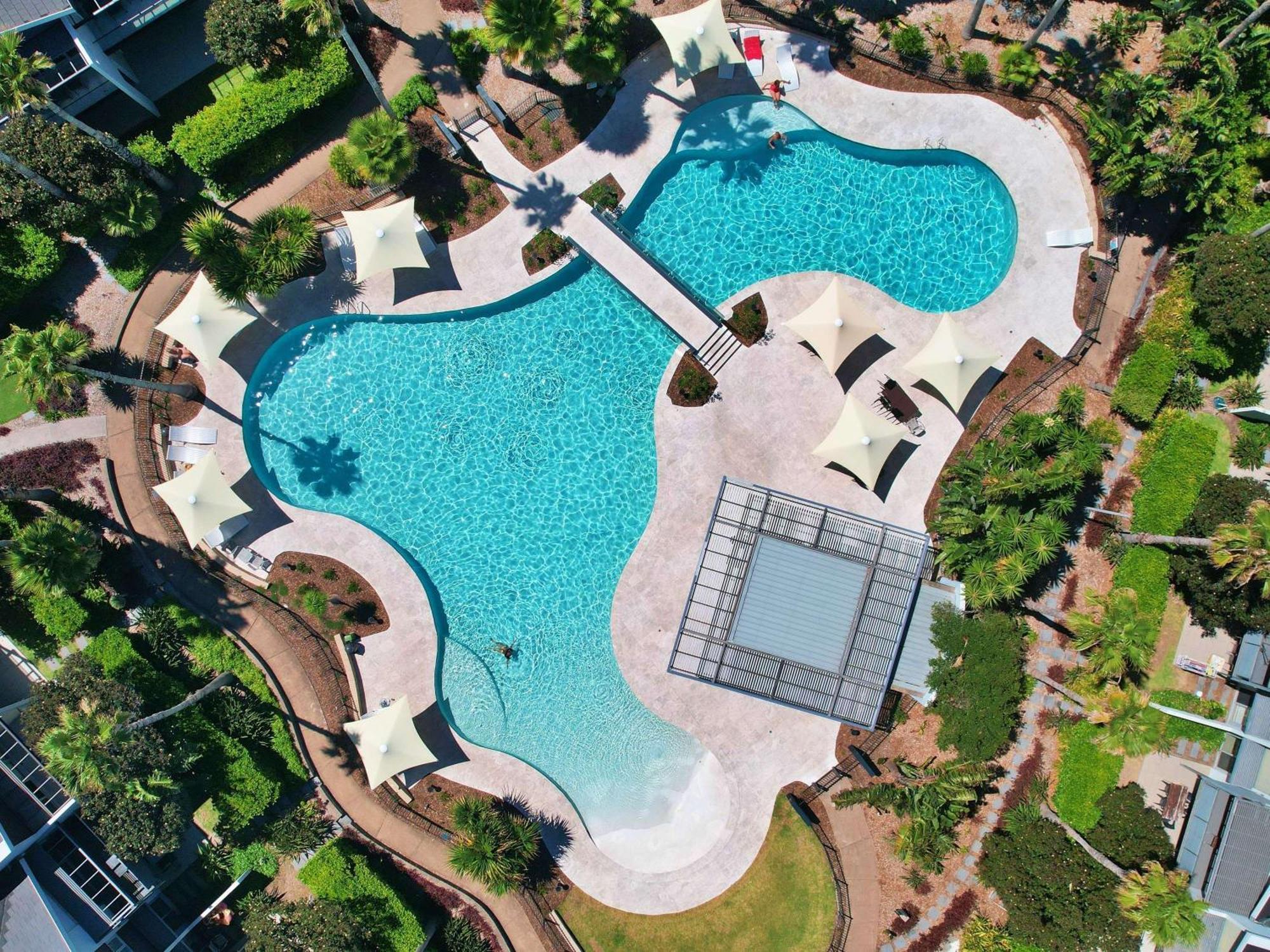 Pullman Magenta Shores Resort Entrance Esterno foto Aerial view of the pool